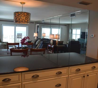 Looking across the low bar separating the kitchen and dining area - with the beach beyond.