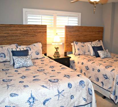 This Guest bedroom has two Queen beds instead of the normal singles... So, stretch out and get a good nights sleep.