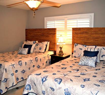 Plantation shutters, ceiling fan, and a flat screen television will make your family or guest feel right at home.