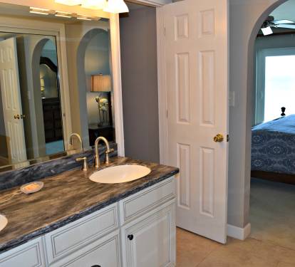 Master bath looking to the balcony and beach beyond.