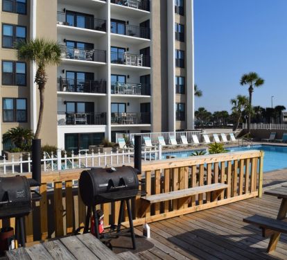 Just off the beach and great deck and BBQ grills. Spend the day, enjoy!