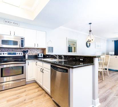 Fully stocked kitchen with stainless steel appliances