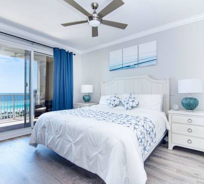 Master bedroom with king size bed and balcony access to ocean views