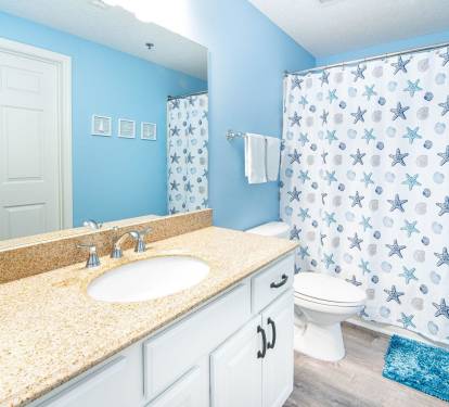 Guest bathroom with granite counter and tub/shower combo