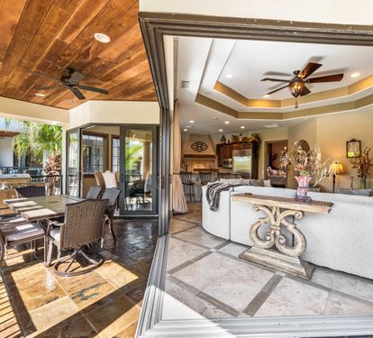 Expansive sliding glass doors that open to create one cohesive gathering space.