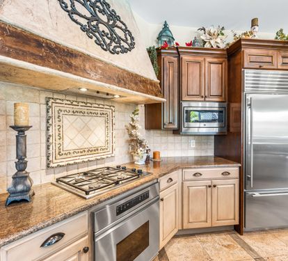 Granite countertops & Sub-Zero refrigerator