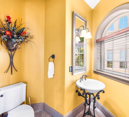 Unique pedestal sink in the powder room.
