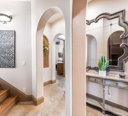 Elegance immediately greets you in the foyer with a unique curved staircase leading up to the 2nd floor.