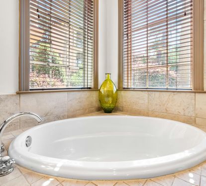 A bathtub perfect for soaking after a day at the beach. This bathroom is shared by the king bedroom and the bunk bedroom.