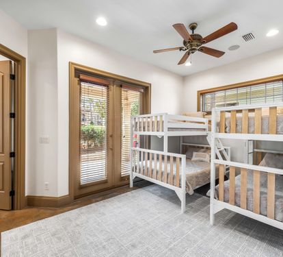 First floor bunk bedroom with a twin over twin and a twin over full beds.