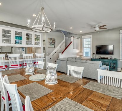 The breakfast bar’s got 5 seats for morning chats, and the large dining table’s ready for dinner plans!