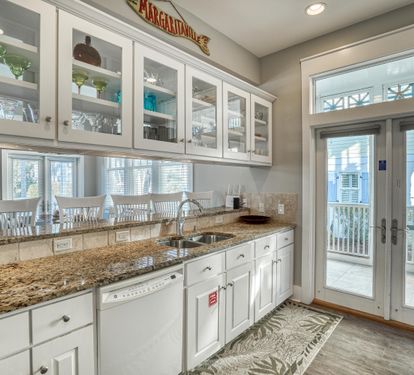 Beautiful custom cabinetry & easy access to your propane grill.