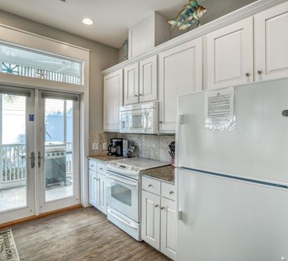 Galley style kitchen with plenty of storage space.