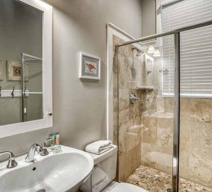 Access this convenient first floor full bathroom with walk-in shower from the hallway or the queen bedroom.