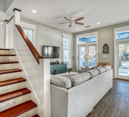 Stairs going up to your beachside primary retreat where you have the entire upper floor to yourselves!