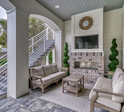 Outdoor Living Area with Fireplace and Flat Screen Television