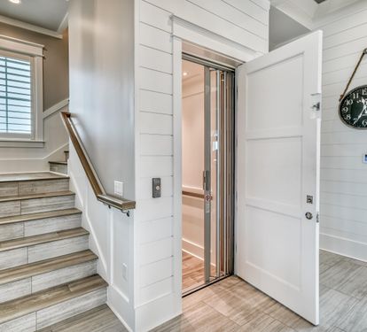 First floor stairs and elevator servicing all three floors.