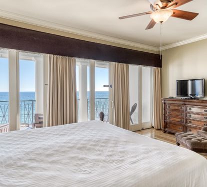3rd Floor King Primary Bedroom, Ensuite Bathroom, TV  & Private Covered Beachfront Balcony with Seating