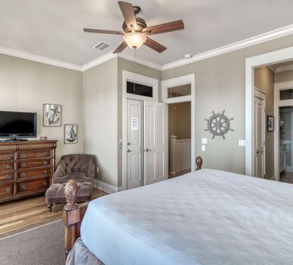 3rd Floor King Primary Bedroom, Ensuite Bathroom, TV & Private Covered Beachfront Balcony with Seating
