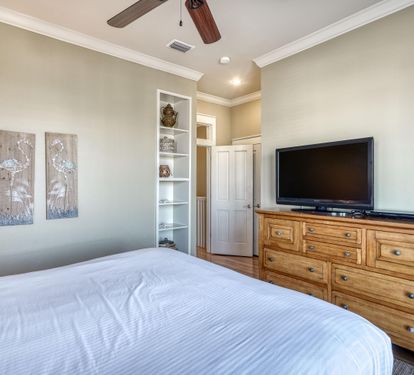 3rd Floor Guest Bedroom with King Bed, Ensuite Bathroom & Balcony Overlooking the Frangista Beach Community.
