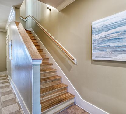 1st Floor Foyer with Whimsical Checkerboard Travertine Tile. Hardwood Floors on the Upper Floors