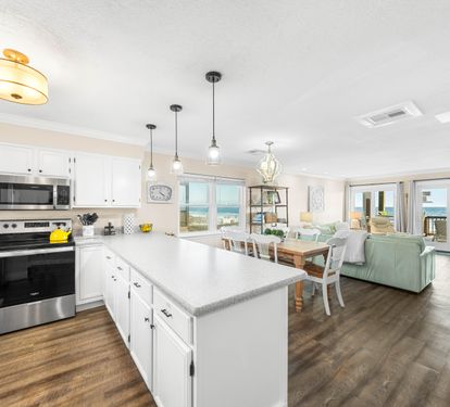 Whip up breakfast with this view, then stroll it straight to the balcony to feast by the ocean.