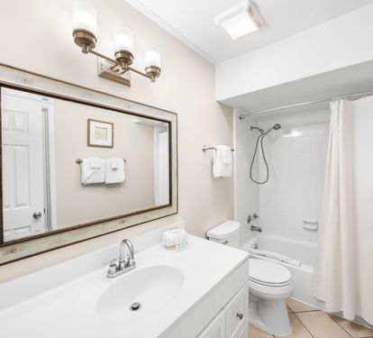 Freshen up in style! Shower and tub combo in this upstairs bath with access from the hall and the double queen bedroom.