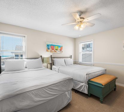 Two queen beds in this lovely upstairs bedroom.