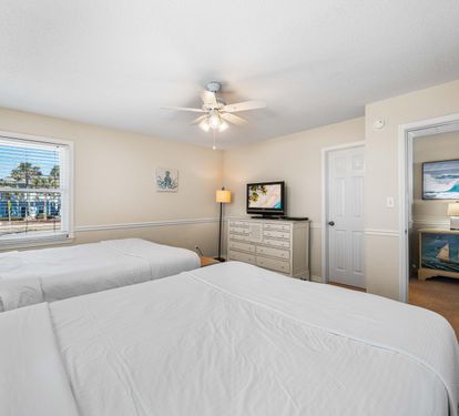 Enjoy a breeze from the overhead ceiling fan while watching a show on this 31" flat  screen tv with cable.