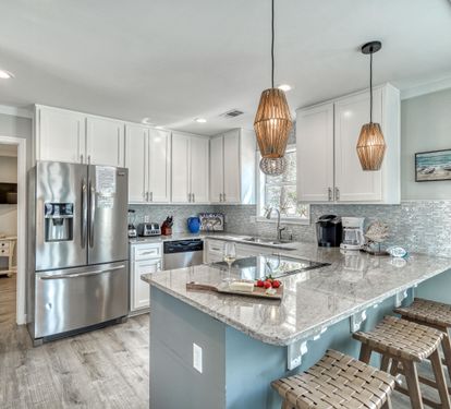 Fully Stocked Kitchen with Bar Seating for 3
