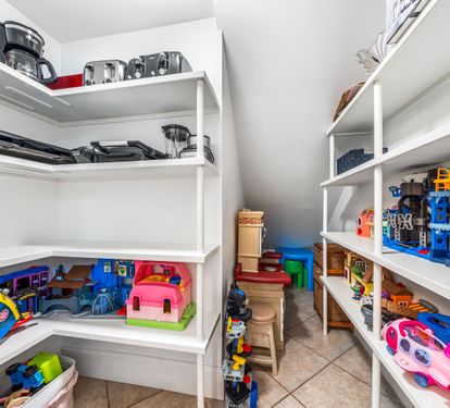 Pantry in the kitchen stocked with toys for the kiddos!