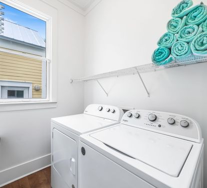 Full Size Washer and Dryer with Plenty of Laundry Supplies!!   And Storage for your Frangista Green & White Beach Towels!