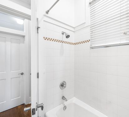 Full Bathroom with Bathtub/Shower Combination in the 1st Floor Bedroom with Queen Bed, with 32" YouTube TV.  This bathroom can also be accessed from the hallway.