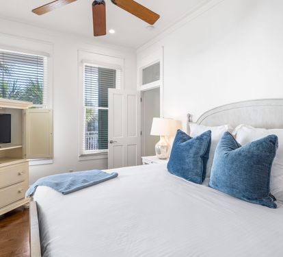 2nd Floor Bedroom with King Bed, 32"YouTube TV inside the Armoire, Ensuite Bathroom & Access to the Outdoor Balcony facing the Gulf.