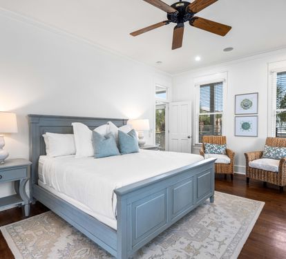 2nd Floor Primary Bedroom with King Bed, 40" YouTube TV, Desk, Walk-in Closet, Ensuite Full Bathroom with Separate Soaking Tub, Walk-in Shower, Double Vanities, & Access to the Covered Balcony with Bistro Tables.