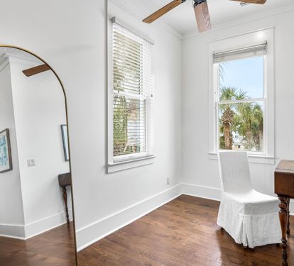 2nd Floor Primary Bedroom with King Bed, 40" YouTube TV, Desk, Walk-in Closet, Ensuite Full Bathroom with Separate Soaking Tub, Walk-in Shower, Double Vanities, & Access to the Covered Balcony with Bistro Tables.
