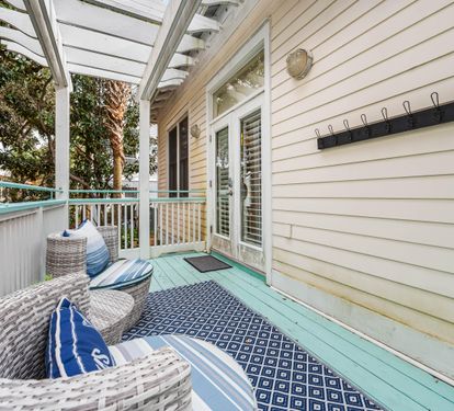 Back deck seating area with plenty of hooks for beach  towels
