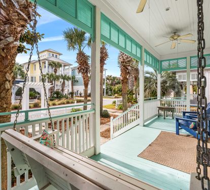 Gather outside and unwind in Sea Blessings' front porch swing.