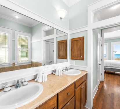 Primary king bedroom ensuite bathroom with separate soaking tub, double vanity sinks, walk-in shower.