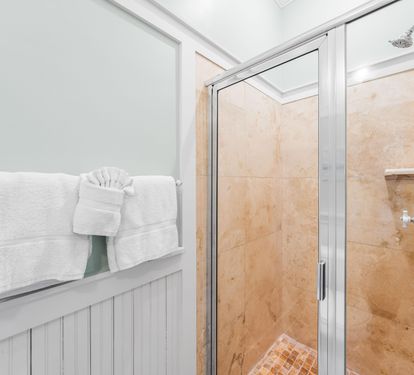 Natural stone walk-in shower in this 2nd floor ensuite bathroom