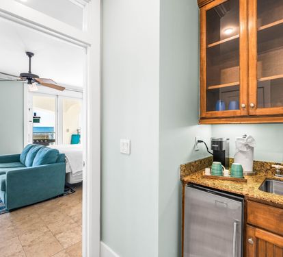 Wet bar on the 1st floor with beverage cooler and Keurig coffee maker.