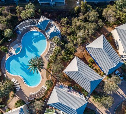 Giant lagoon style pool with separate heated spa for this small family-friendly gated community.