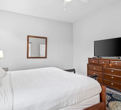 Second floor primary bedroom with ensuite bathroom & 50" Smart TV with cable.
