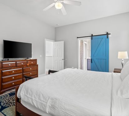 Second floor primary bedroom with ensuite bathroom & 50" Smart TV with cable.