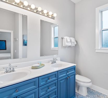 2nd floor ensuite bathroom for the primary king bedroom with double vanities, separate walk-in shower & soaking bathtub.