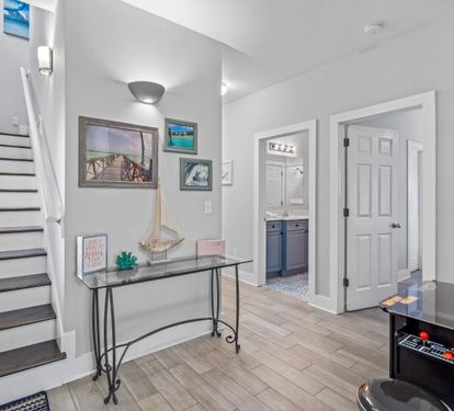 Attractive first floor foyer with a nook for the game arcade the kids will love.  3 additional bedrooms occupy this first floor.