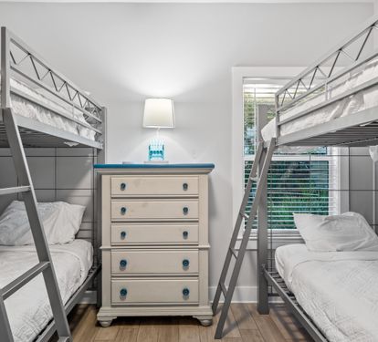 First floor bunk bedroom with 2 sets of twin over twin beds & a 31" tv with cable.