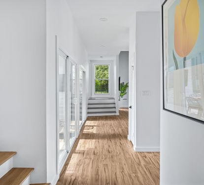 To the left are stairs leading to the two guest bedrooms