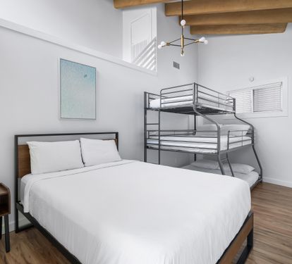 Queen bed with triple bunk, queen on the bottom,a full in the middle and twin on top with en suite bath. Bedroom #4