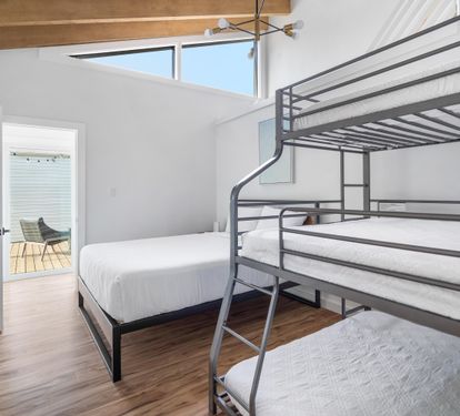 Queen bed with triple bunk, queen on the bottom,a full in the middle and twin on top with en suite bathroom/shower. Bedroom #4